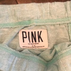 Mint green VS Pink sweatpants.